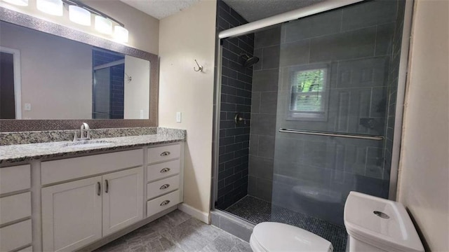 full bathroom with a stall shower, toilet, and vanity