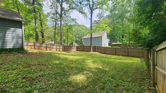 view of yard with a fenced backyard