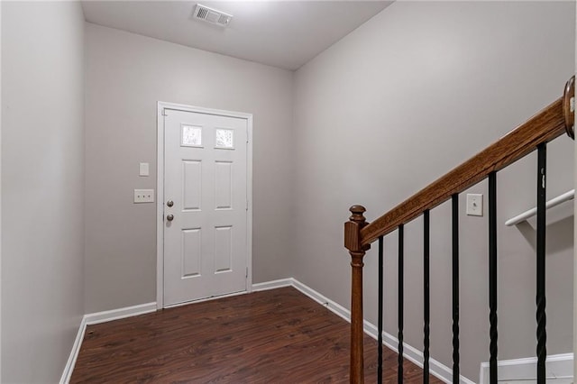 foyer entrance with dark hardwood / wood-style floors