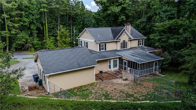 back of property featuring a sunroom