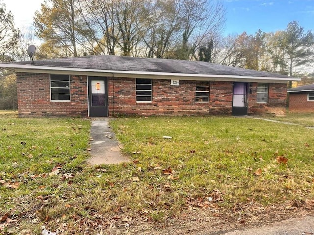 ranch-style home with a front yard