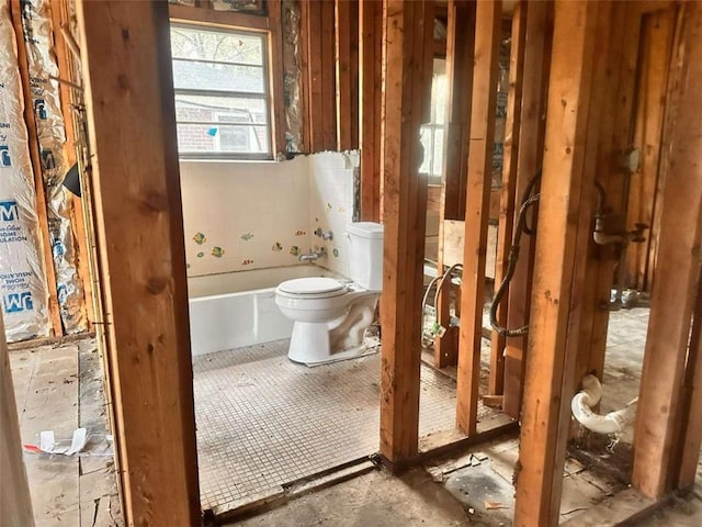 bathroom featuring a bathtub and toilet