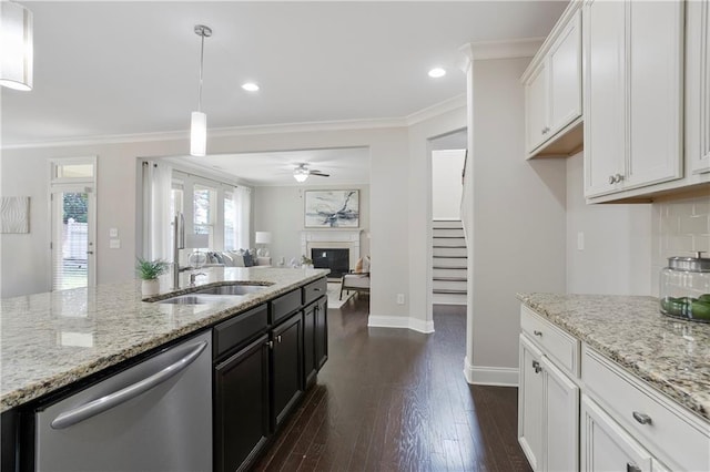 kitchen featuring a ceiling fan, dark wood-style flooring, white cabinets, dishwasher, and crown molding