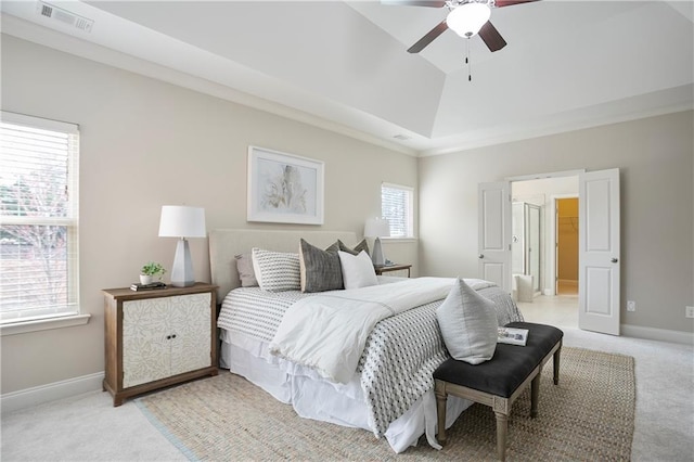 bedroom with visible vents, ceiling fan, baseboards, light colored carpet, and vaulted ceiling