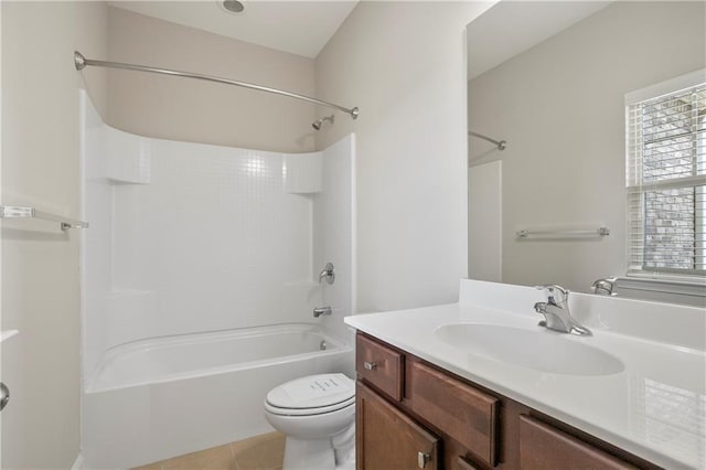 full bath featuring tile patterned floors, toilet, bathtub / shower combination, and vanity