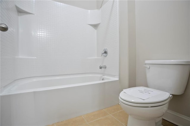 bathroom featuring toilet, bathing tub / shower combination, and tile patterned flooring