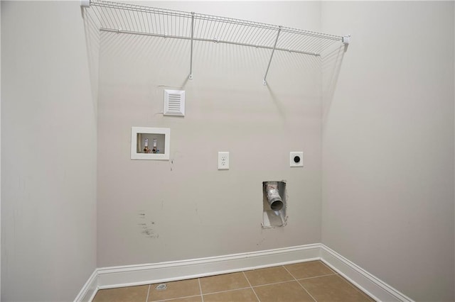 clothes washing area featuring baseboards, laundry area, hookup for a washing machine, tile patterned floors, and hookup for an electric dryer