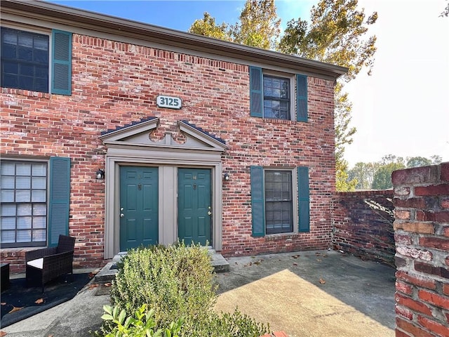 view of front of home with brick siding