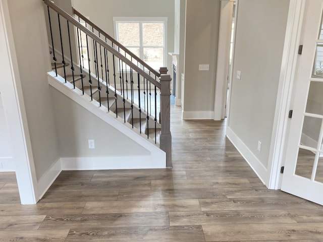 3355 Hillshire Dr, Cumming, GA 30028 - foyer entrance with wood finished floors, baseboards, and stairs