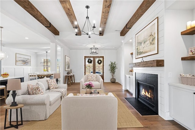 39 Telfair Ct, Acworth, GA 30101 - living area with wood finished floors, beam ceiling, a chandelier, a fireplace with flush hearth, and recessed lighting
