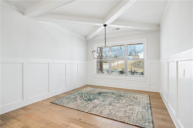 39 Telfair Ct, Acworth, GA 30101 - unfurnished dining area with a decorative wall, beam ceiling, wainscoting, wood finished floors, and coffered ceiling