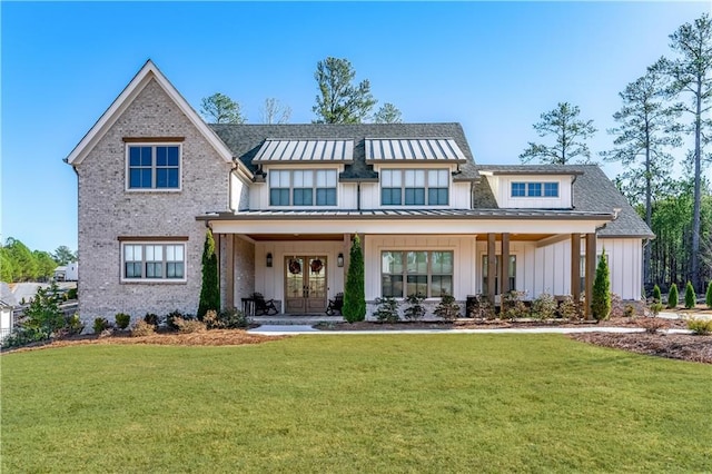 39 Telfair Ct, Acworth, GA 30101 - view of front of home featuring board and batten siding, a standing seam roof, a front yard, brick siding, and french doors