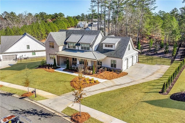 39 Telfair Ct, Acworth, GA 30101 - modern inspired farmhouse featuring covered porch, driveway, and metal roof