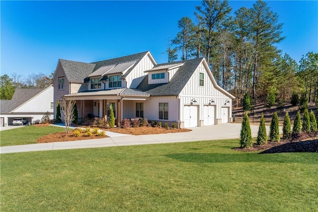 39 Telfair Ct, Acworth, GA 30101 - modern farmhouse with board and batten siding, driveway, a front lawn, a standing seam roof, and an attached garage