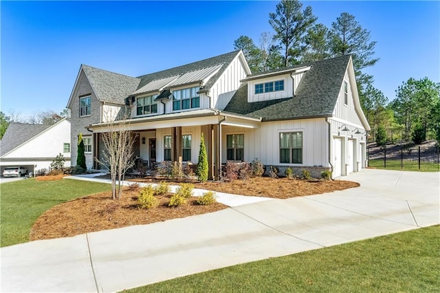 39 Telfair Ct, Acworth, GA 30101 - modern farmhouse style home featuring board and batten siding, driveway, covered porch, and a garage