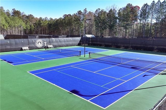 view of sport court with community basketball court and fence