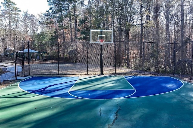 view of sport court with community basketball court and fence