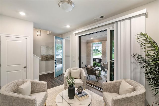 living area with hardwood / wood-style floors