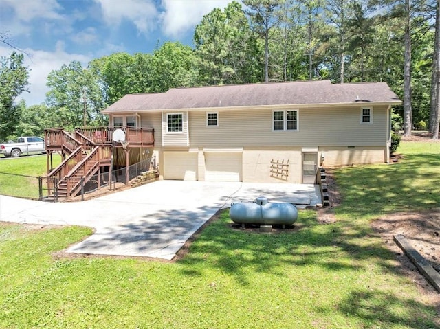 586 Old Bushmill Rd, Bremen, GA 30110 - rear view of property featuring an attached garage, stairs, concrete driveway, a wooden deck, and view of scattered trees