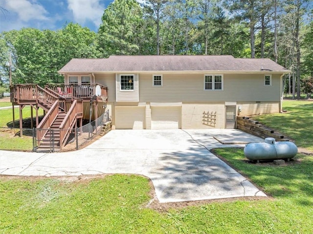 586 Old Bushmill Rd, Bremen, GA 30110 - view of front of house with a garage, stairs, a deck, driveway, and a front yard