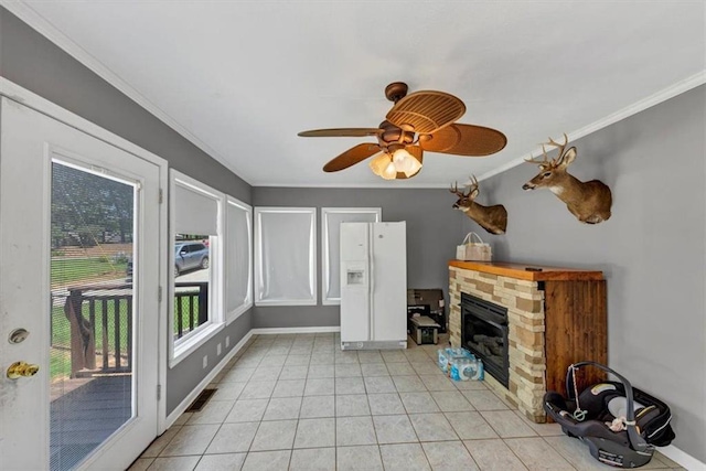 586 Old Bushmill Rd, Bremen, GA 30110 - living room featuring crown molding, a stone fireplace, baseboards, light tile patterned flooring, and ceiling fan