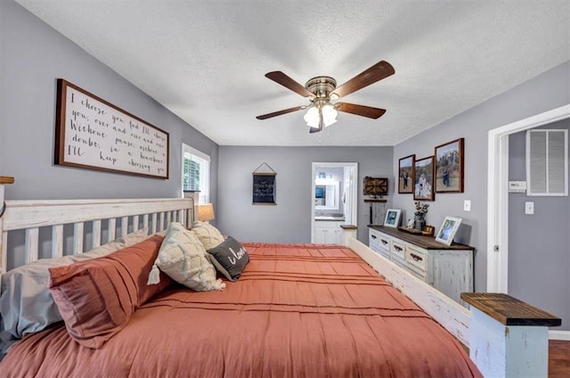 586 Old Bushmill Rd, Bremen, GA 30110 - bedroom with a textured ceiling, baseboards, connected bathroom, and ceiling fan