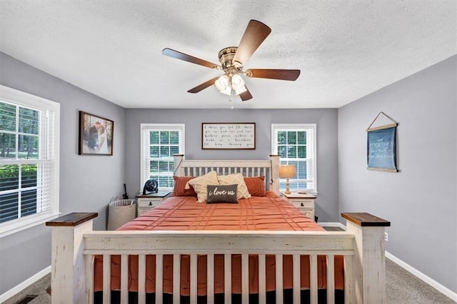 586 Old Bushmill Rd, Bremen, GA 30110 - carpeted bedroom with baseboards, a textured ceiling, and a ceiling fan