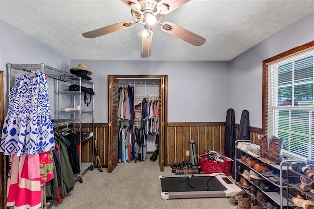 586 Old Bushmill Rd, Bremen, GA 30110 - bedroom featuring a textured ceiling, wood walls, a wainscoted wall, a closet, and carpet floors
