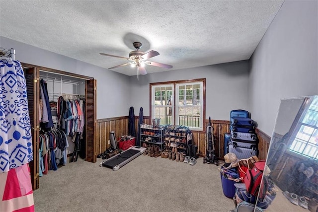 586 Old Bushmill Rd, Bremen, GA 30110 - game room featuring a wainscoted wall, wood walls, a ceiling fan, carpet flooring, and a textured ceiling