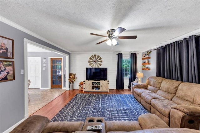 586 Old Bushmill Rd, Bremen, GA 30110 - living room with ornamental molding, ceiling fan, wood finished floors, a textured ceiling, and baseboards
