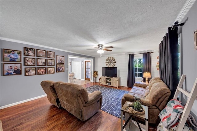 586 Old Bushmill Rd, Bremen, GA 30110 - living area featuring a textured ceiling, wood finished floors, ornamental molding, ceiling fan, and baseboards