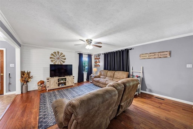 586 Old Bushmill Rd, Bremen, GA 30110 - living area with crown molding, a textured ceiling, a ceiling fan, wood finished floors, and baseboards