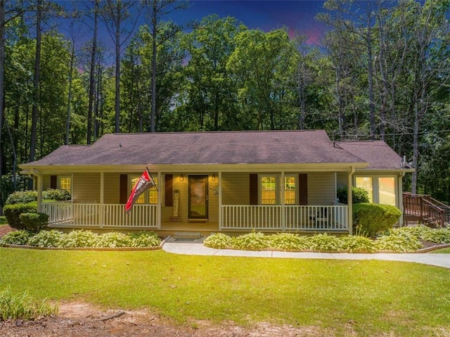 586 Old Bushmill Rd, Bremen, GA 30110 - ranch-style house featuring covered porch, a front lawn, and a shingled roof