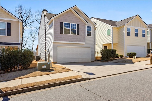 view of front of house with central air condition unit, driveway, a garage, and a chimney