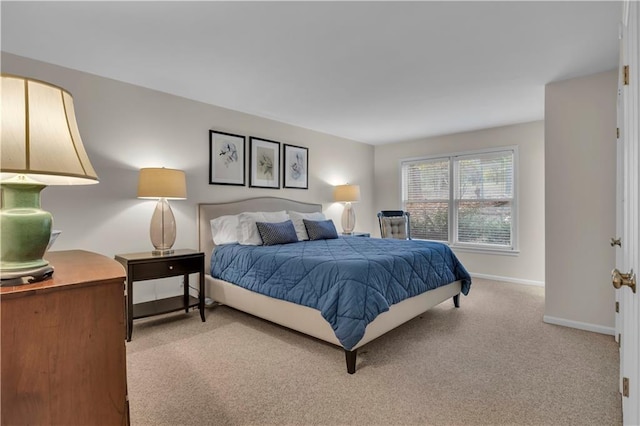 bedroom with light colored carpet