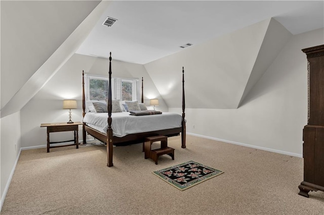 bedroom featuring light carpet and lofted ceiling