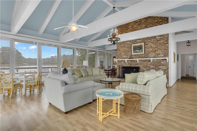 living room featuring beam ceiling, high vaulted ceiling, and light hardwood / wood-style floors