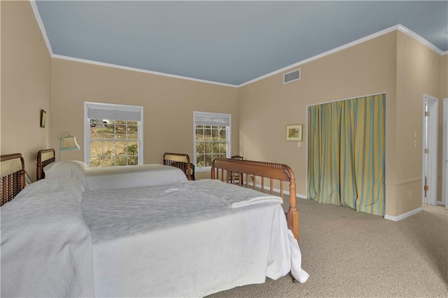 carpeted bedroom featuring ornamental molding