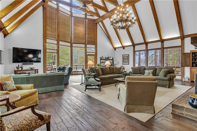 living room with hardwood / wood-style flooring, a notable chandelier, high vaulted ceiling, and beamed ceiling