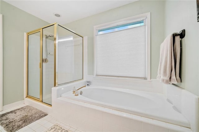 bathroom featuring tile patterned floors, a stall shower, and a bath