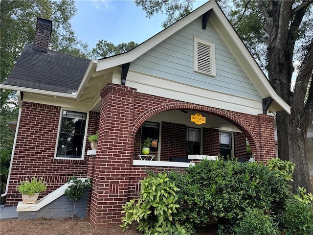 1670 Rogers Ave SW, Atlanta, GA 30310 - view of front of house with covered porch, brick siding, and a chimney