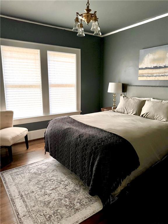 1670 Rogers Ave SW, Atlanta, GA 30310 - bedroom with wood finished floors and ornamental molding