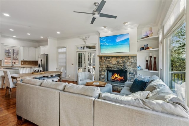 sunroom / solarium featuring ceiling fan and plenty of natural light