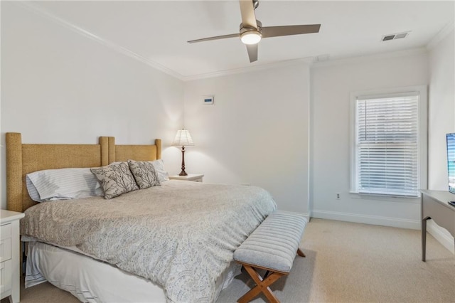 bedroom with ceiling fan, light colored carpet, and crown molding