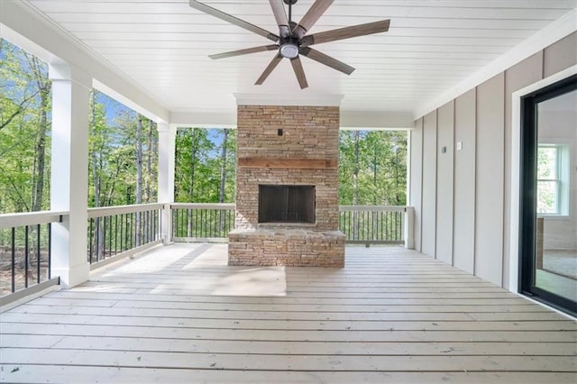 5990 Watermark Cv, Gainesville, GA 30506 - wooden terrace with an outdoor stone fireplace and ceiling fan
