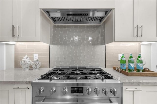 5990 Watermark Cv, Gainesville, GA 30506 - kitchen featuring stainless steel gas range oven, ventilation hood, decorative backsplash, and white cabinets