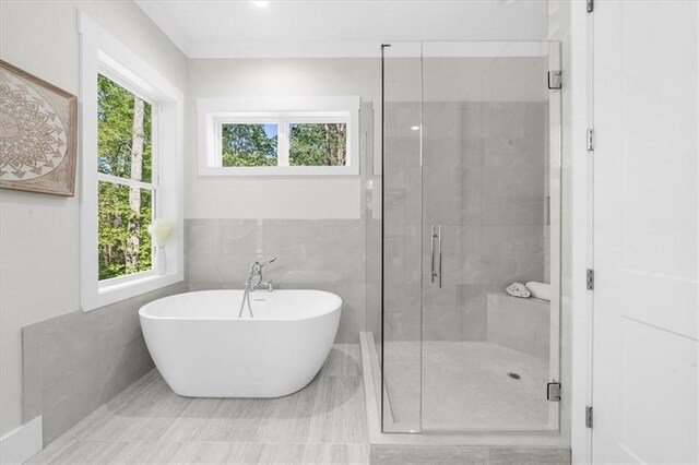5990 Watermark Cv, Gainesville, GA 30506 - bathroom with tile walls, a freestanding bath, and a shower stall