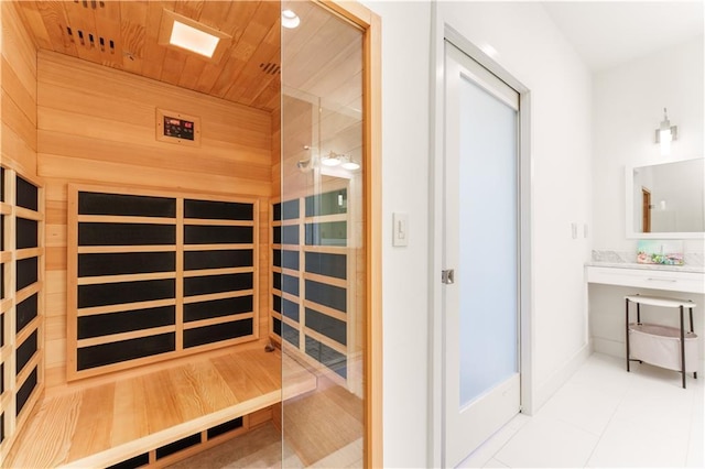 view of sauna / steam room with tile patterned flooring and baseboards