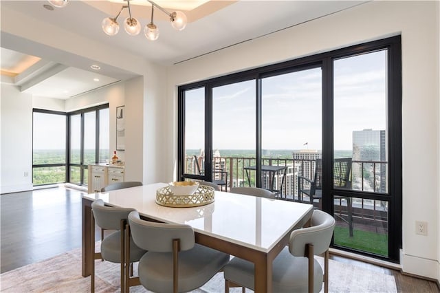 dining room with a chandelier, recessed lighting, and wood finished floors