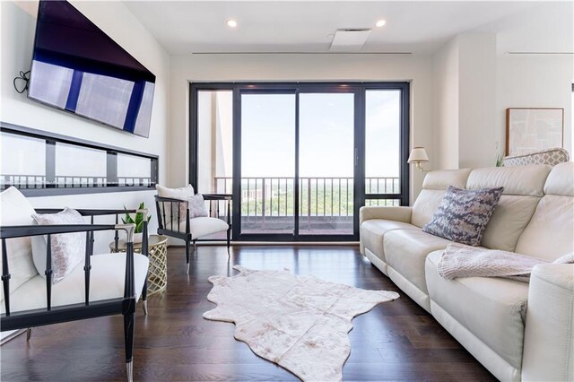 living room featuring wood finished floors and recessed lighting